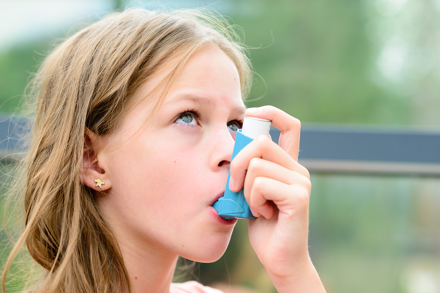 bigstock Pretty Girl Using Asthma Inhal 119293265