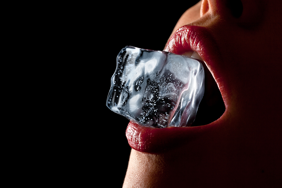 bigstock Ice cube in woman s mouth 32452385